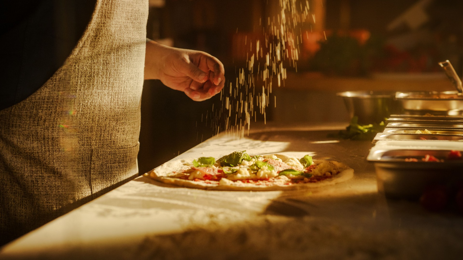 In Restaurant Professional Chef Preparing Pizza, Kneading Dough, Spinning and Tossing it, Traditional Family Recipe. Authentic Pizzeria with Deliciously Organic Food. Cinematic Sunny Shot